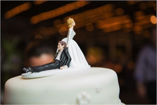 bride draagging groom cake topper